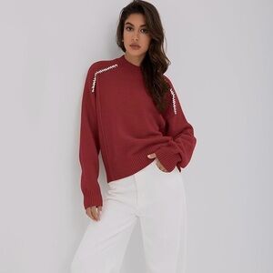 Red Sweater with White Stitch Accents